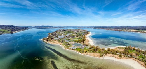Aerial view, panorama of the island of Reichenau at low tide and spring-like vegetation, Lake