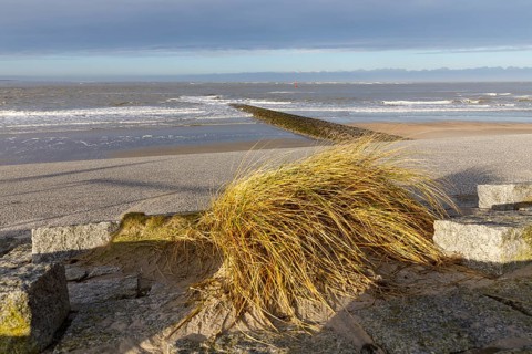 Paved beach promenade and groyne on the west beach of Norderney, Lower Saxony, Germany, Europe
