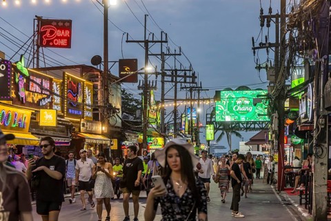 Crowds of people on Bangla Street in the evening. Nightlife on Bangla Walking Street with go-go