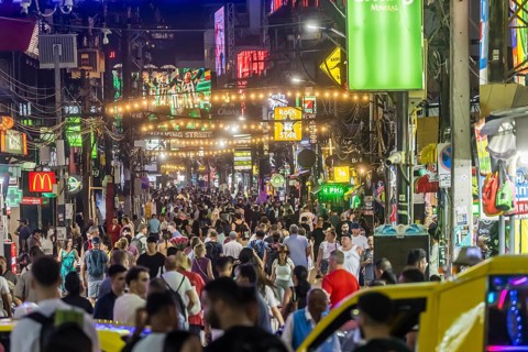 Crowds of people on Bangla Street in the evening. Nightlife on Bangla Walking Street with go-go