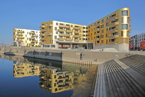 Modern golden building Pandion Doxx and reflection in the harbour, quay, quay wall, staircase,