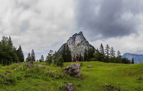 Hiker on the Schartenalm with a view of the Sparber, Osterhorn group, Salzkammergut, Salzburg