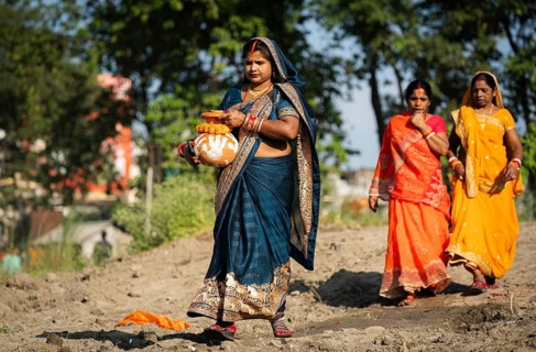 Hindu devotees perform rituals as they offer prayers to the Sun god in the bank of Brahmaputra