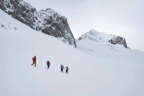 Ski tourers in a snowy mountain landscape, ascent to the Wildhorn, cloudy mood, high tour, Bernese