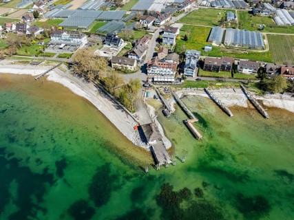 Aerial view of the southern part of the island of Reichenau at low tide and spring-like vegetation,