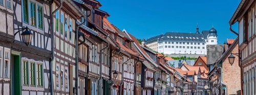 Street with half-timbered houses in the old town, the castle in the background, Stolberg im Harz,