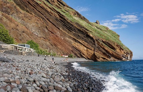 On the beach of Garajau, Ponta do Garajau stone beach, bathing beach, cliffs, Garajau, municipality