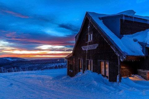 Wossecker Baude at dusk on a winter's day, Harrachsdorf in the Giant Mountains, Czech Republic,