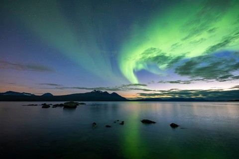 Northern Lights over Lake Akkajaure and Akka mountain range, Stora Sjöfallet National Park,