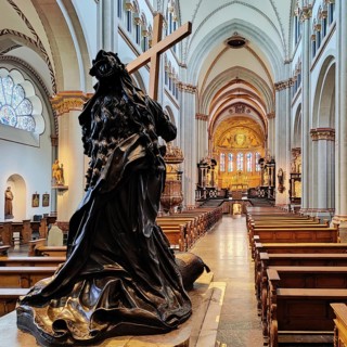 Interior view of Bonn Minster, bronze statue of St Helena with nave and view to the east apse,