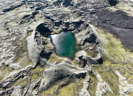 Lake in Tjarnargigur crater, moss-covered Laki crater or Lakagígar, series of craters, aerial view,