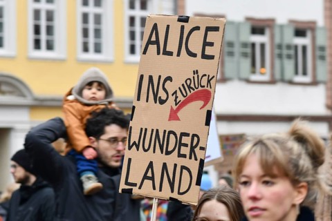Heidelberg, Germany - February 12th 2025: Person holding up sign with text 'Fascism is not an