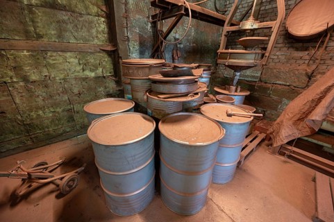 Metal barrels in the bronze powder filling room of a metal powder mill, founded in 1900, Igensdorf,