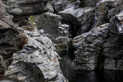 Rocks, granite rock formations in the Maggia River near Ponte Brolla, in the Maggia Valley, Valle