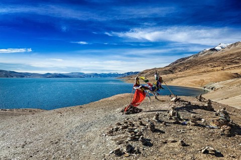 Buddhist prayer flags lungta at Himalayan lake Tso Moriri, Korzok, Ladakh, India, Asia