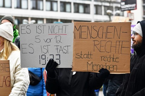Heidelberg, Germany - February 12th 2025: People with signs with text at protest against far-right
