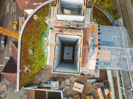 Roof shot of a construction site with various building materials and structures, ZOB Calw