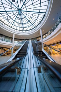 Escalator in a shopping centre leading to a large glass roof, Sterncenter Sindelfingen, Böblingen