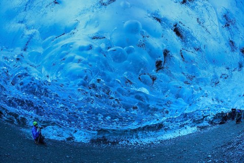 Tourist inside an ice cave, glacier cave, Vatnajökull, Iceland, Europe