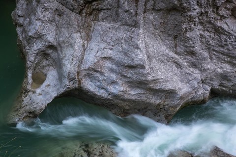 The Lammer creek is flowing fast through the Lammerklamm on a sunny hiking day
