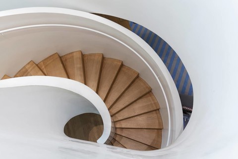 Modern spiral staircase in Vitra Haus, wooden steps, architects Herzog & de Meuron, Vitra Campus,