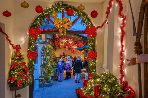 Christmas decorated passage to the mulled wine stand in the side passage at the Christmas market,