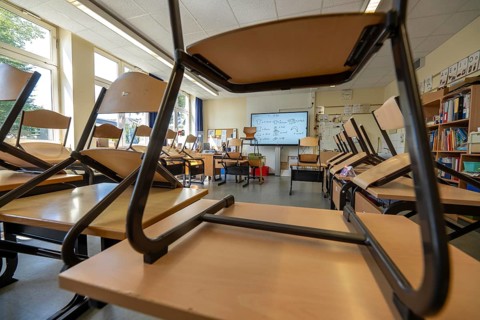 Classroom of a fourth grade, after school, the building is older but in good condition, modern
