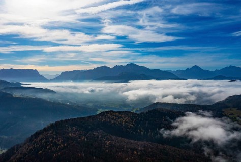 View from Schwarzenberg to a sea of fog in the Salzach valley with Watzmann and Untersberg,