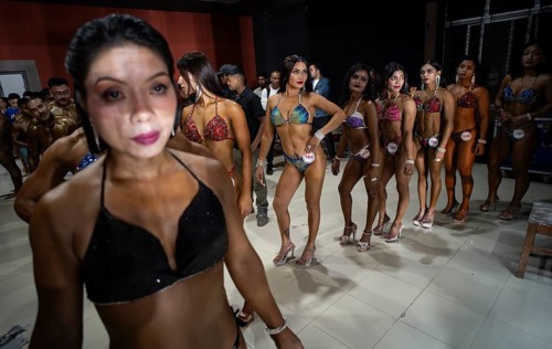 Female bodybuilders wait backstage to compete the 4th Ms Saraighat all India classic body building
