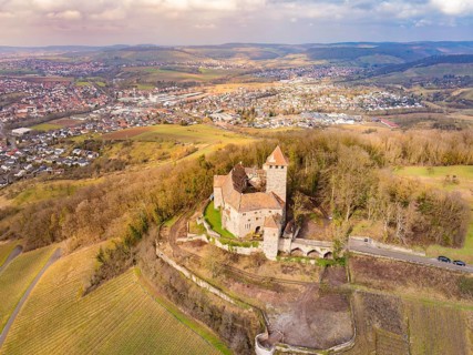 Historic castle on a hill with panoramic views over a town and fields, Lichtenberg Castle,
