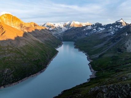 Alpine panorama with Pigne d'Arolla, Lac de Dix, sunset in the mountains, reservoir, Valais Alps,