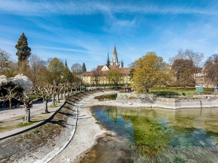 Aerial view of the old town of Constance with the island canal at low tide, on the left the