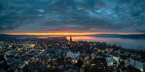 Aerial view, panorama of an atmospheric sunrise over the town of Radolfzell on Lake Constance with