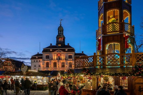 Christmas market with large Christmas pyramid on the market square, behind the historic town hall,