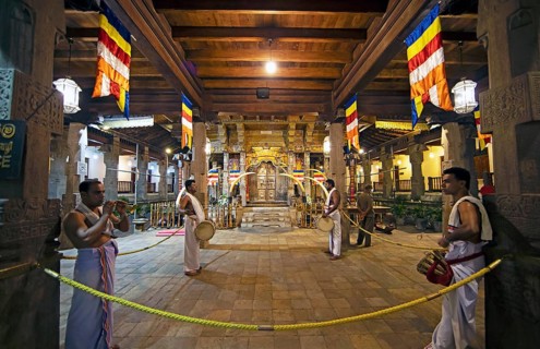 Drummers and flute players at a shrine in the Buddhist Temple of the Tooth or Sri Dalada Maligawa,