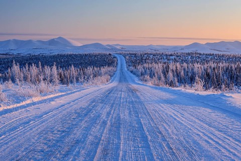 Snow-covered gravel road, highway, ice, snow, cold, mountain landscape, winter, morning mood,