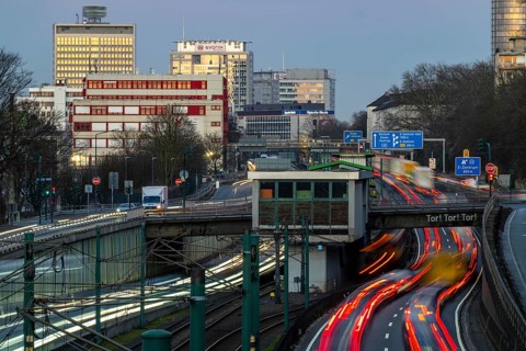 Motorway A40, Ruhr expressway, heavy traffic jam, rush hour, city passage in Essen, skyline of the