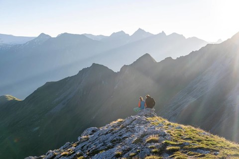 Hiker enjoying the mountain panorama in the morning, Venedigergruppe, Hohe Tauern, Austria, Europe
