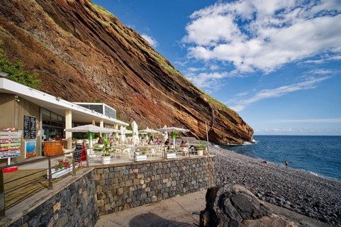 On the beach of Garajau, Ponta do Garajau stone beach, bathing beach, cliffs, Garajau, municipality