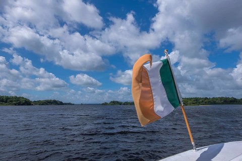 Irish flag waving on a boat, Ireland, Europe