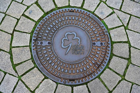 Manhole cover with coat of arms of the city of Fürth-Bavaria, Middle Franconia, Bavaria, Germany,