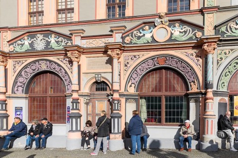 Ornate Renaissance portals on the Cranach House on Weimar's market square, with the town hall in