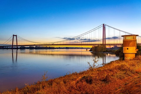 The Emmerich Rhine Bridge, federal road B220, evening light, at 803 m the longest suspension bridge