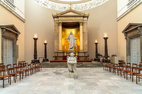Christ statue and baptismal font by Bertel Thorvaldsen in the Church of Our Lady in front of Frue