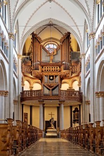 Interior view of Bonn Minster, nave with pulpit and Klais organ in the west apse, Bonn, North