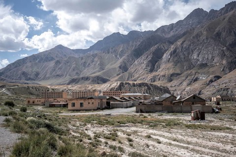 Abandoned ruined buildings in a mountain landscape, ghost town, Engilchek, Tian Shan, Kyrgyzstan,