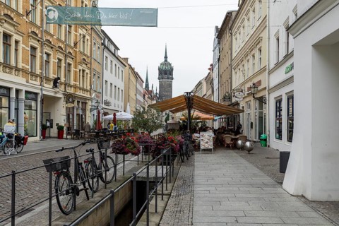 Röhrwasser, the historic water pipe system, in the shopping street, in the background the tower of