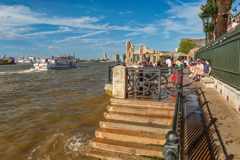 People enjoying the afternoon on the promenade at Travalgar Tavern, Greenwich, London, England,