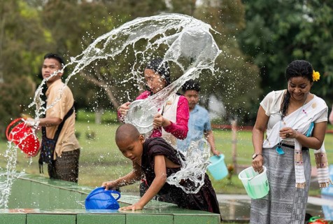 NAMSAI, INDIA.- APRIL 16: Devotees celebrate the vibrant Sangken Festival by pouring water over