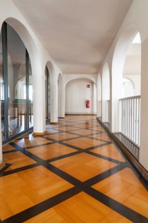Modern hallway with arches and a striking wooden floor, bright atmosphere, Kirchheim Teck, Germany,